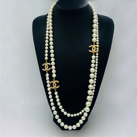 chanel letter necklace black price|chanel long necklace with pearls.